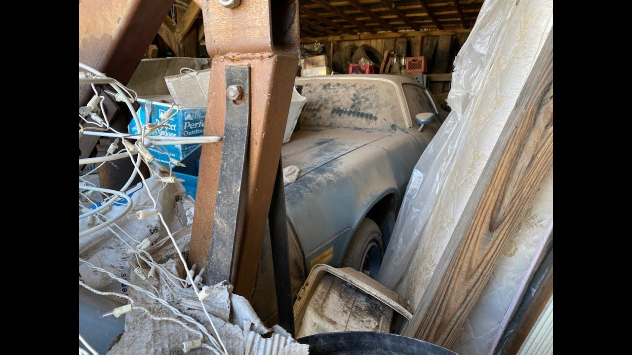 Barn Find BURIED - 1979 Chevy Camaro! Parked in storage 15 years ago and the piling began!!!!!!!! - YouTube