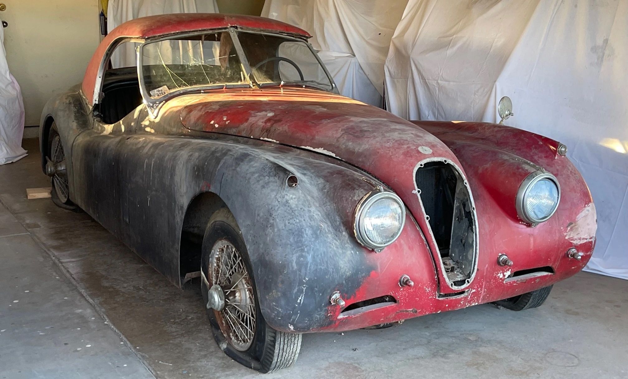 Rough 54 jaguar xk120 project car in garage