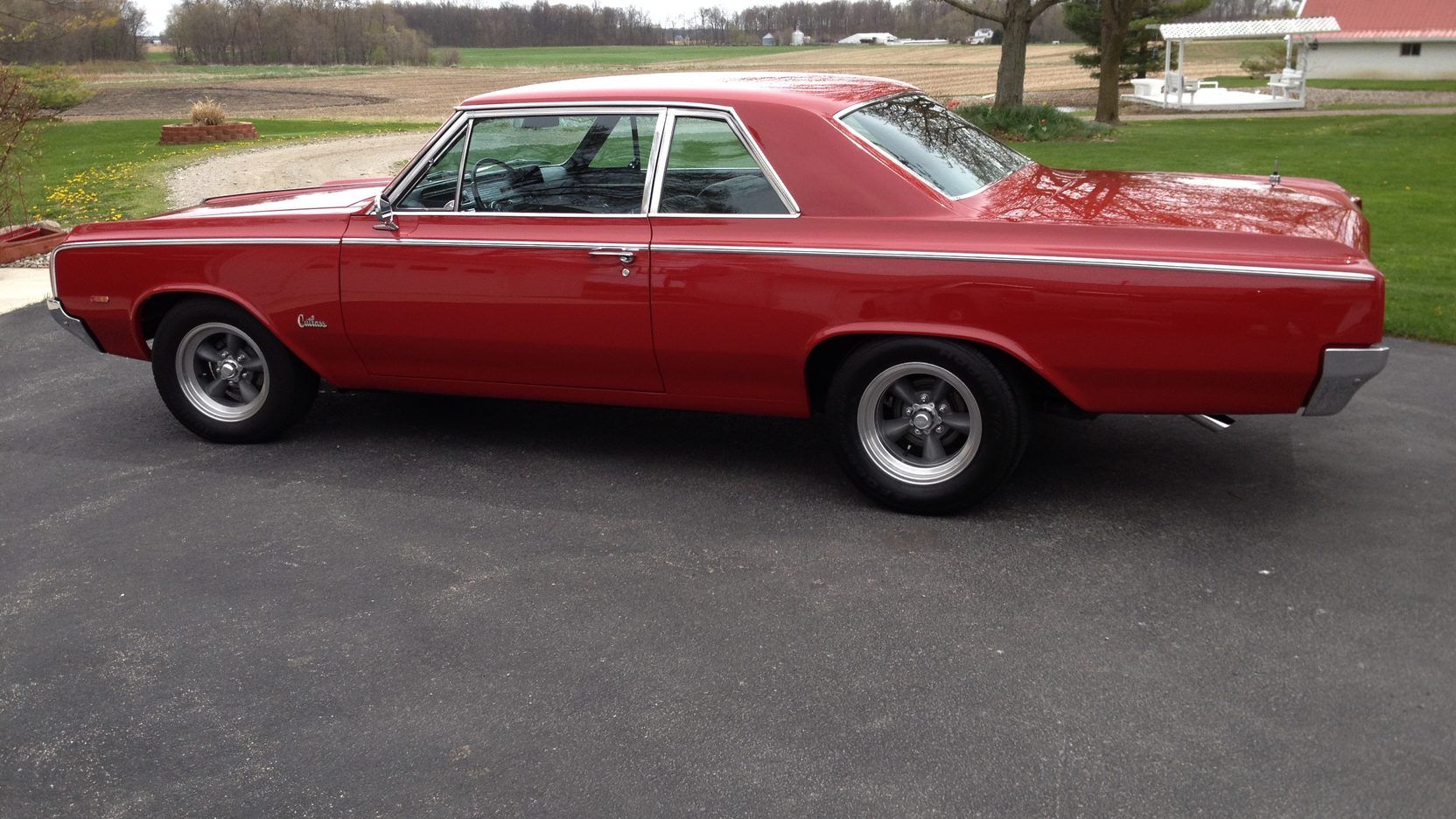 A parked olds Cutlass 442