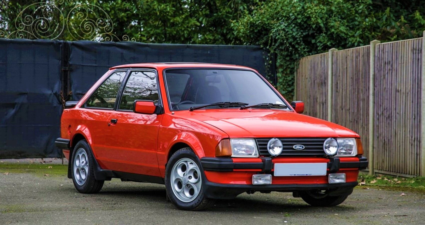 Red Escort XR3i in a compound