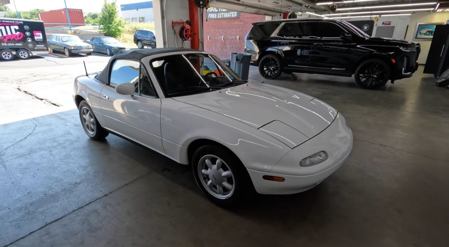 Mazda MX-5 Miata, white, front quarter view in garage