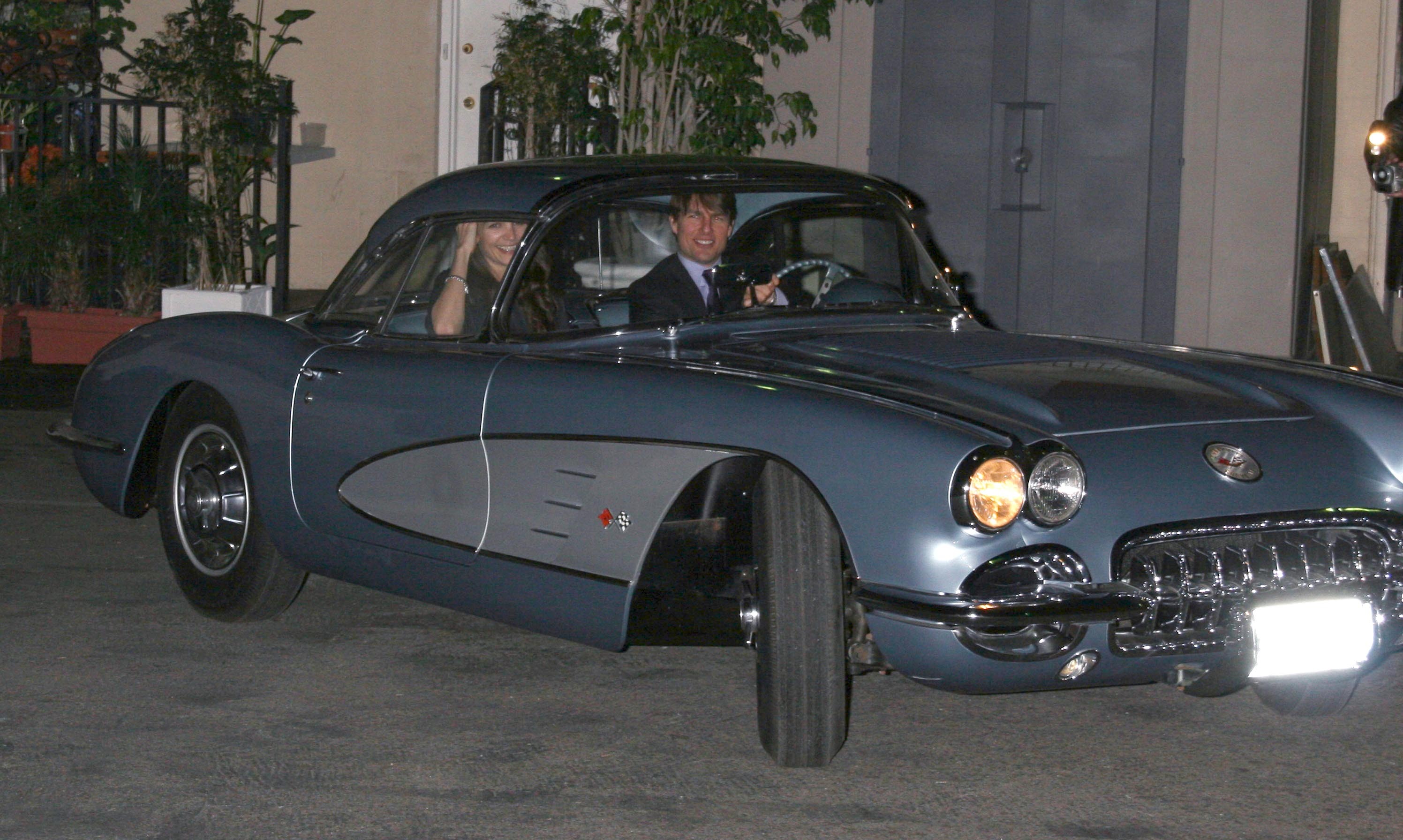 Tom Cruise and Katie Holmes in a Chevrolet Corvette C1