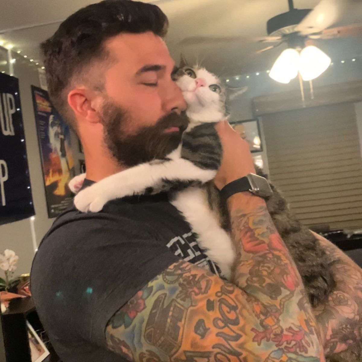 man holding a cat