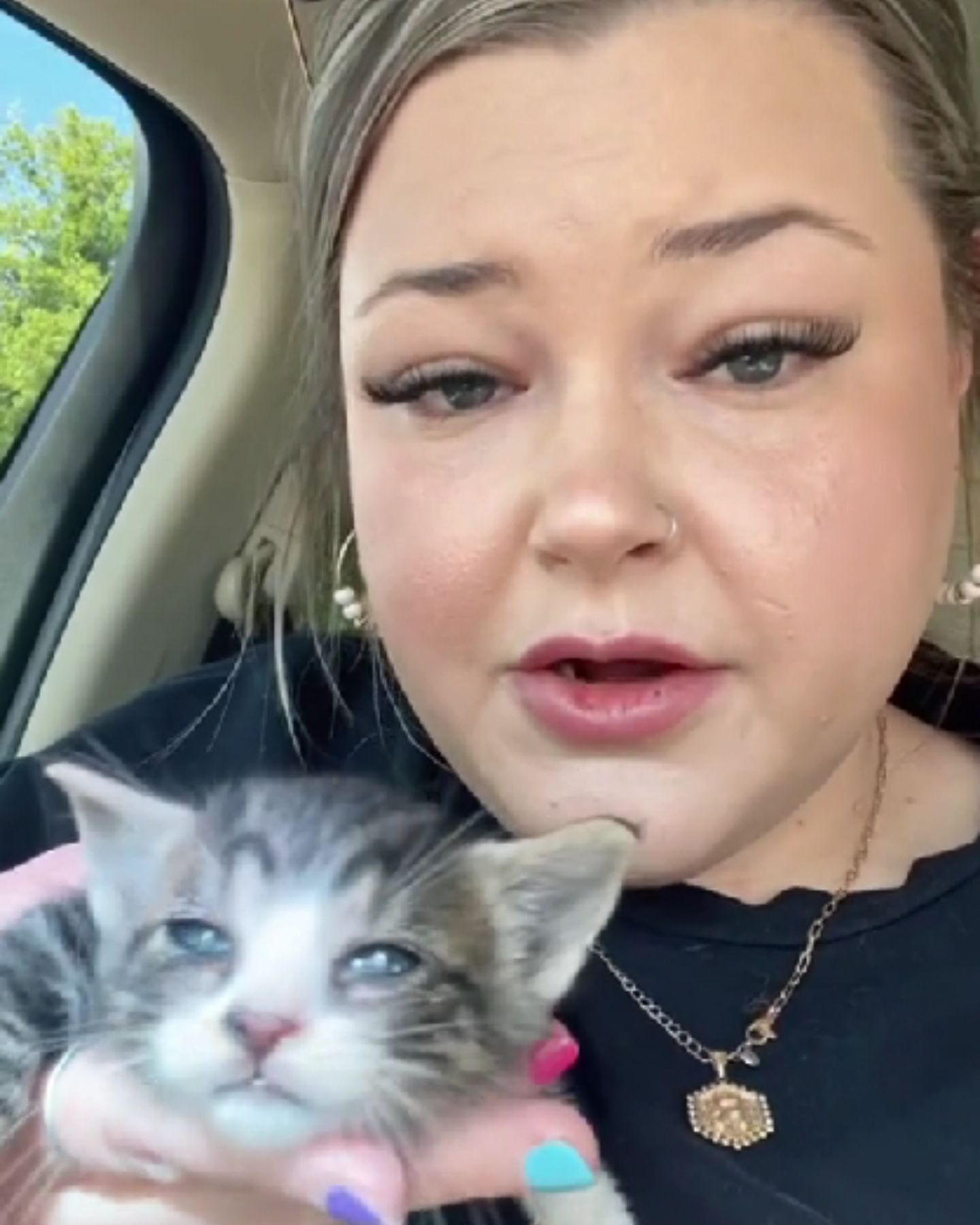 woman holding a kitten