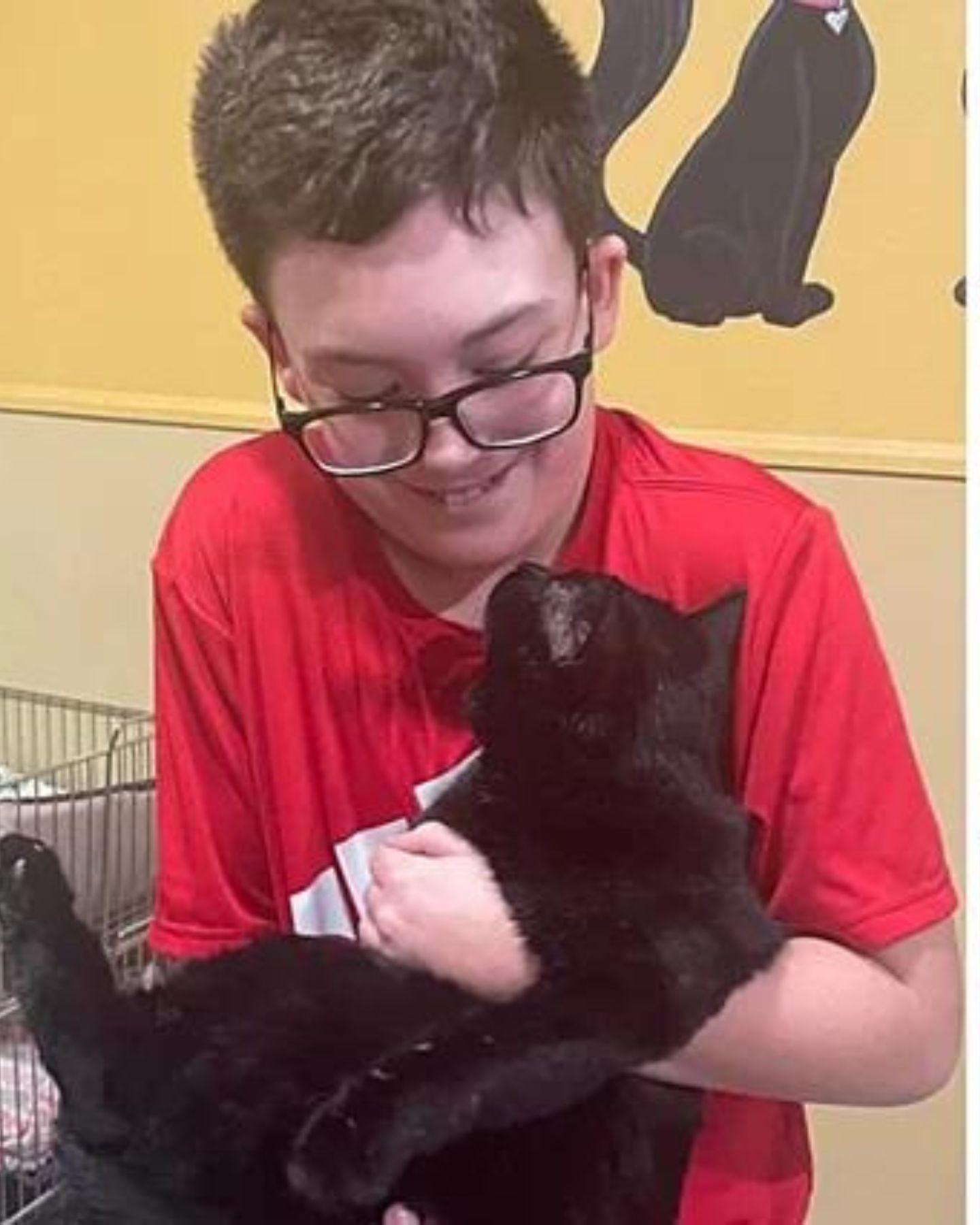 happy kid with black cat