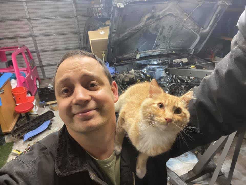 happy man with cat posing