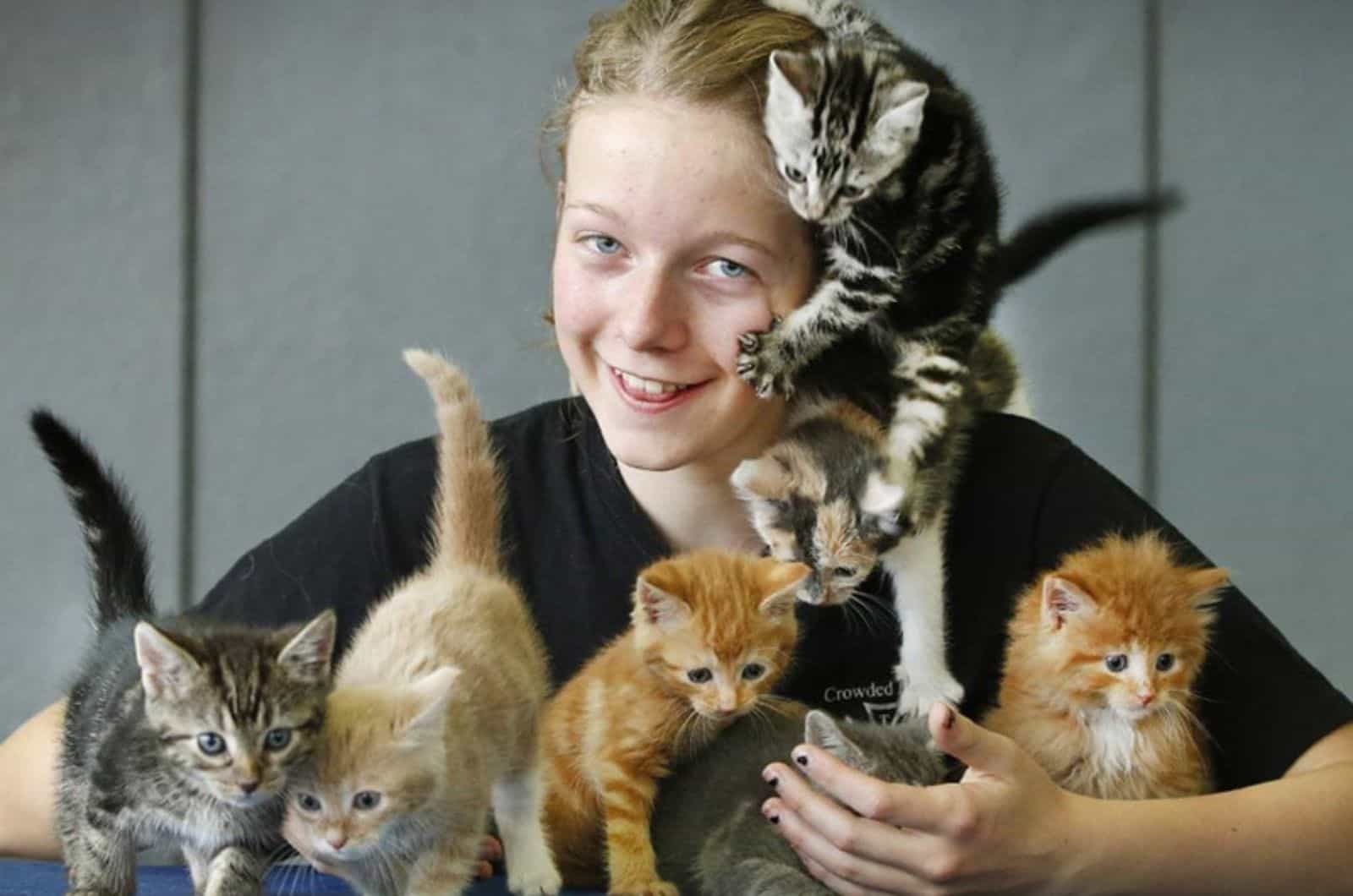 kitten climbing on a girl