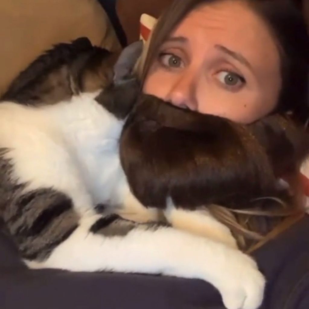 photo of woman with fake beard and cat