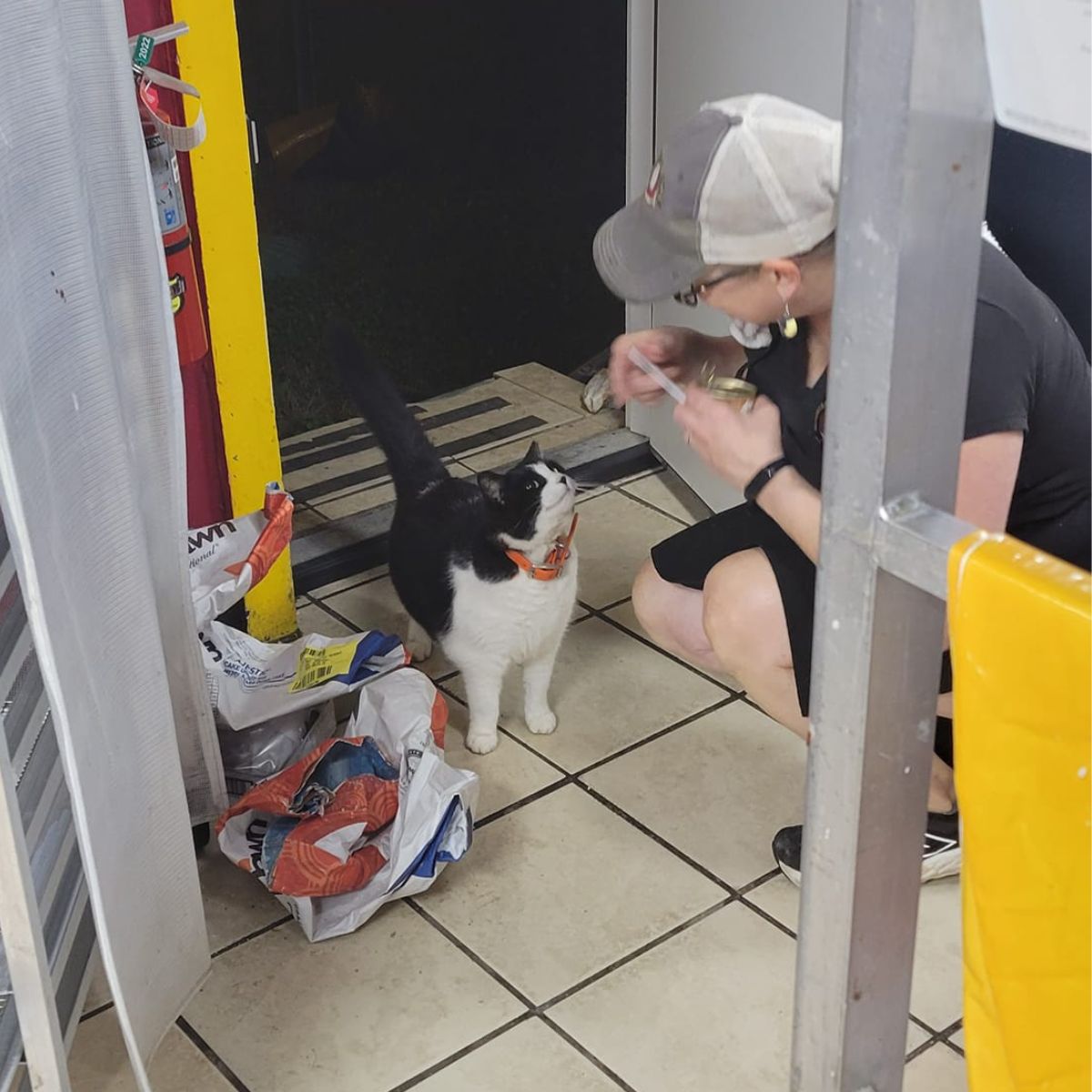 woman holding a can of cat food