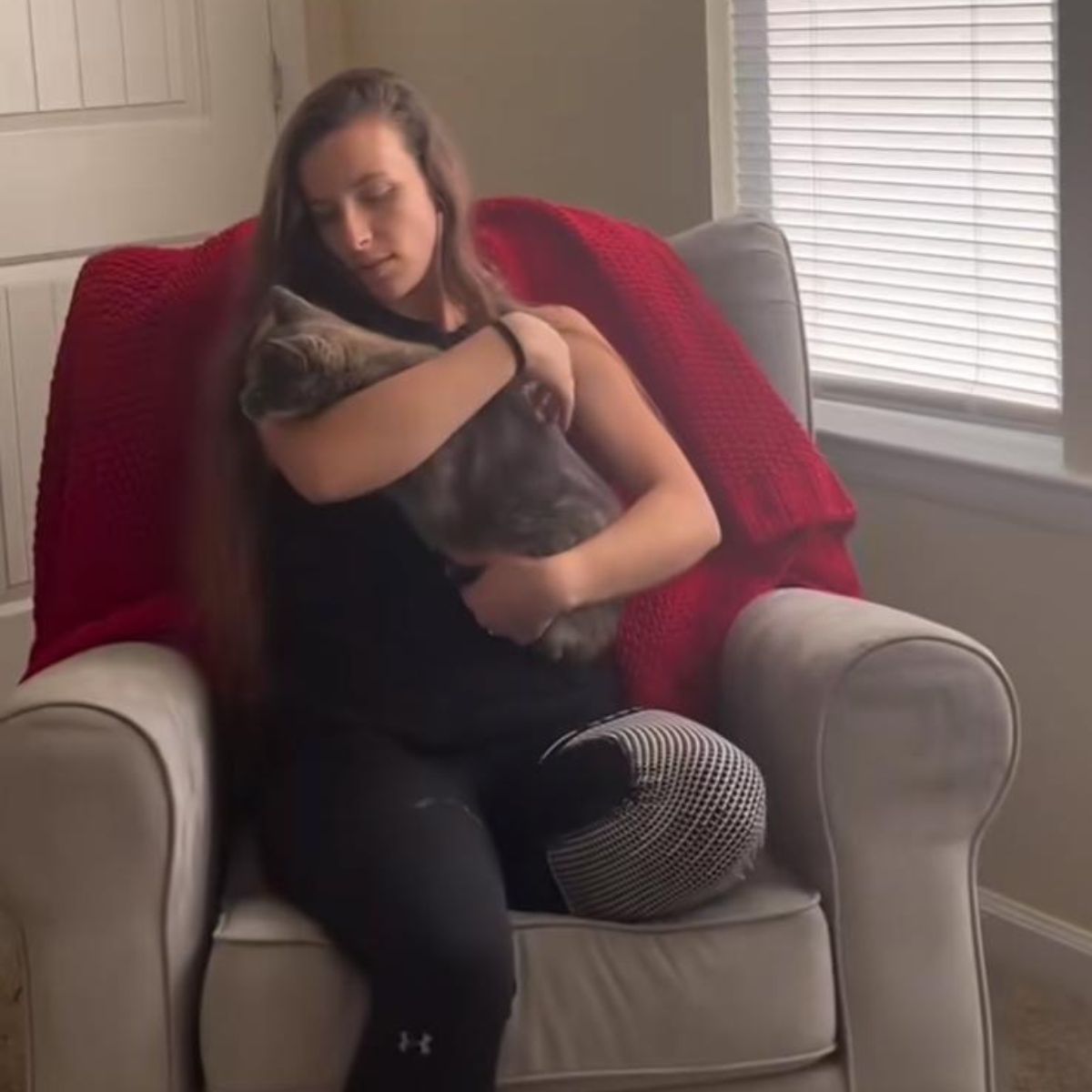 woman holding a cat