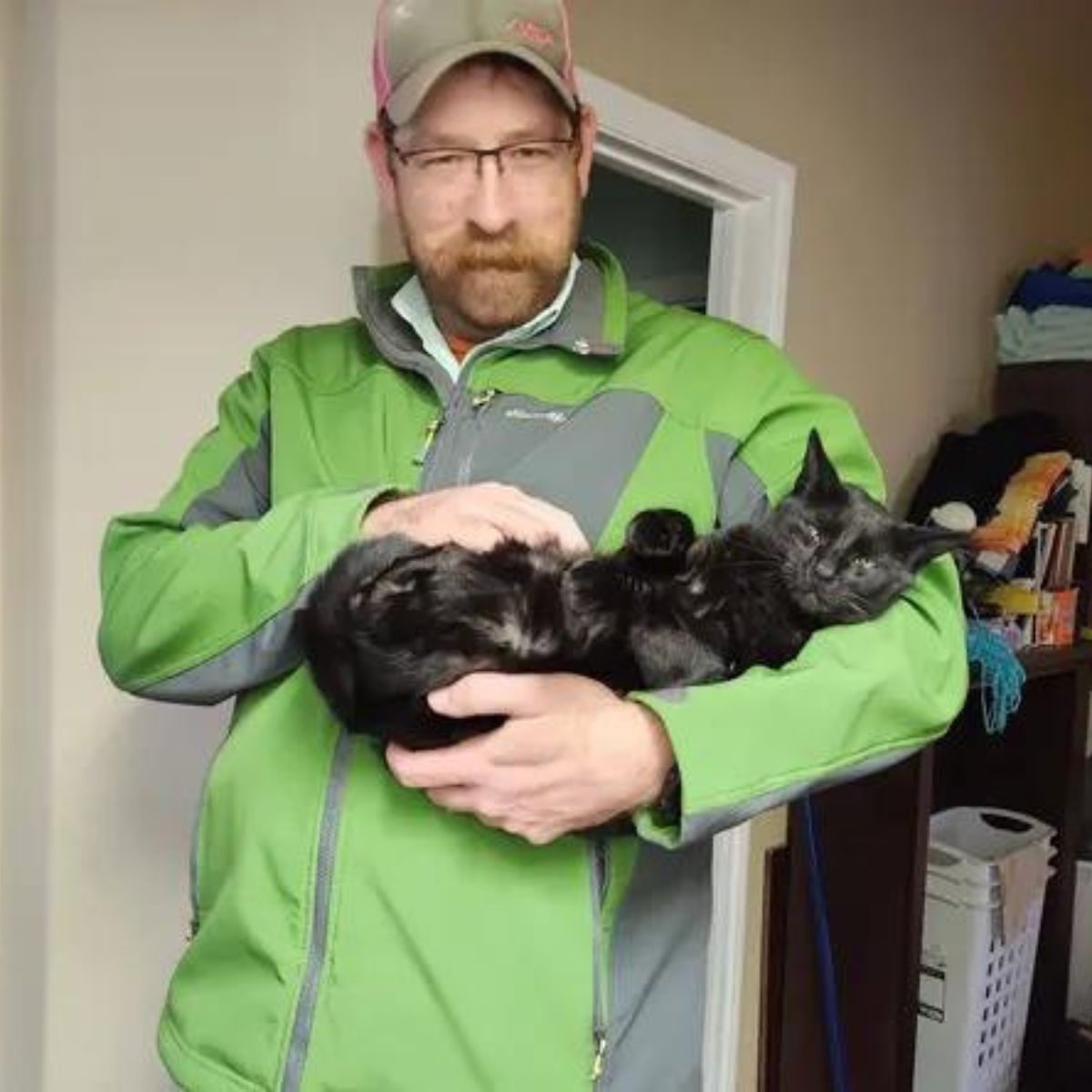 a man holding a cat