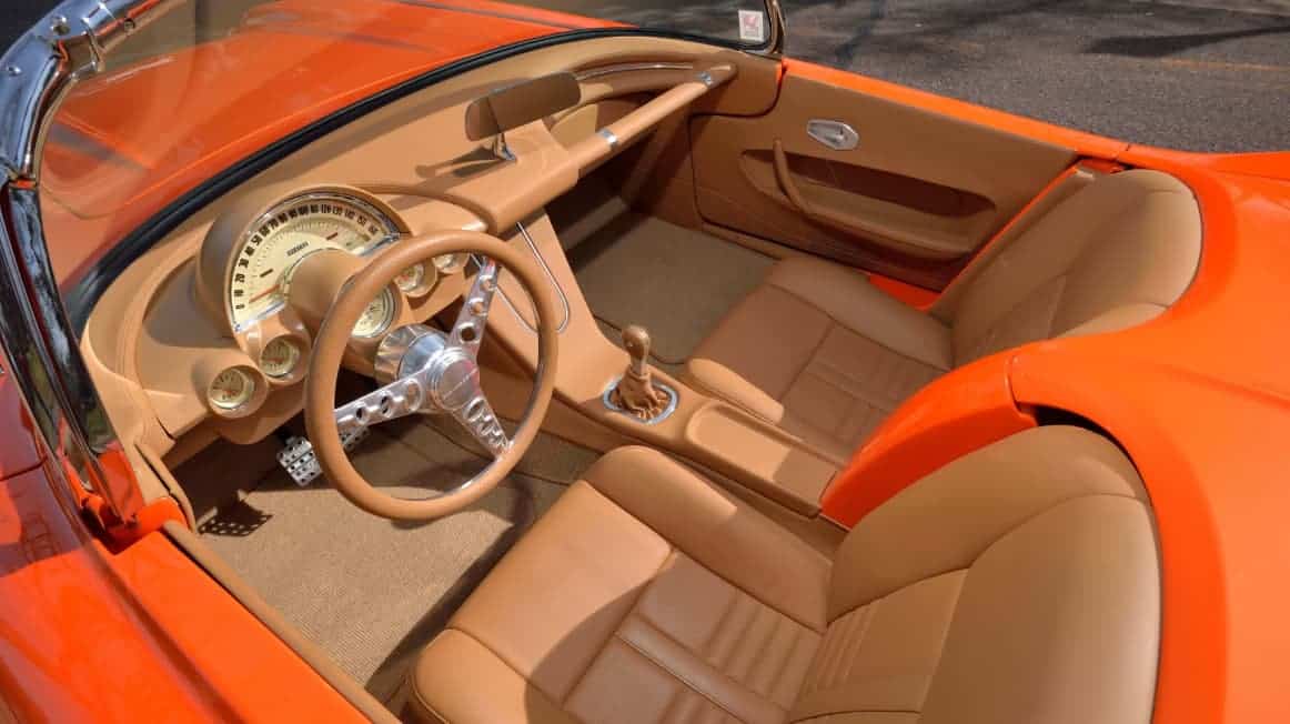 Award-winning 1961 Chevrolet Corvette Custom Rest Mod build with House of Kolor Citric-Hue Tangelo and custom Cream two-tone finish.